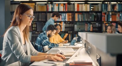 student in library with smart campus security