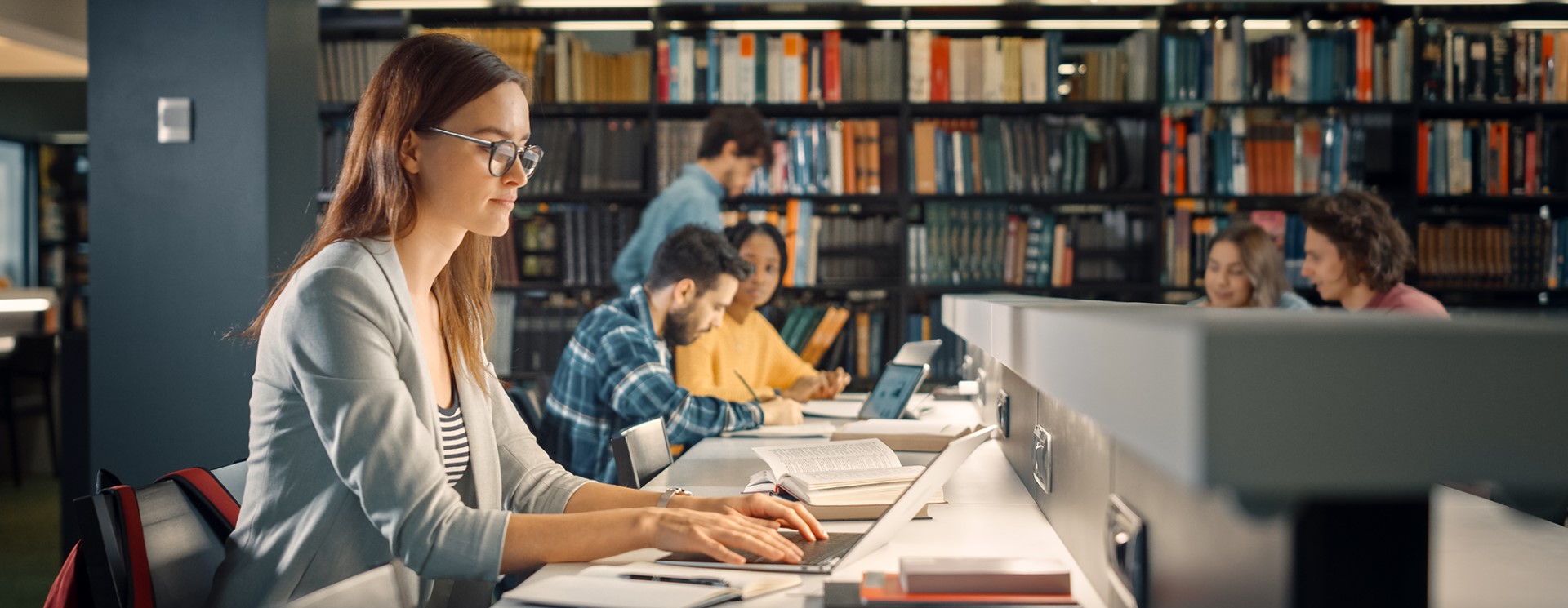 student in library with smart campus security